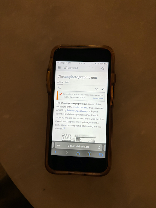 picture of a phone opened to the wikipedia page for chronophotographic gun