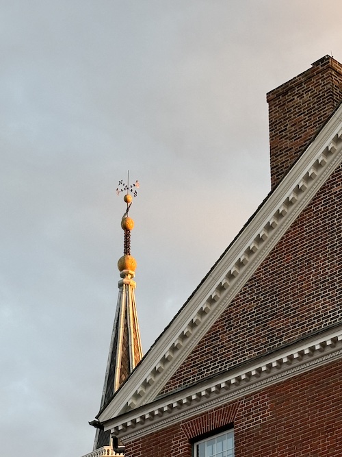 weathervane against sunset in dc