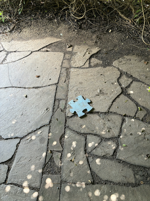 big puzzle piece on the ground