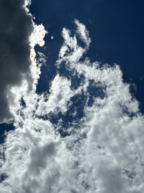 clouds against a really blue sky taken at the pool