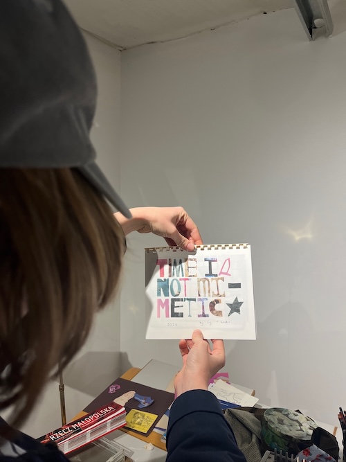 me holding the finished calendar L and I spent a frenzied month making